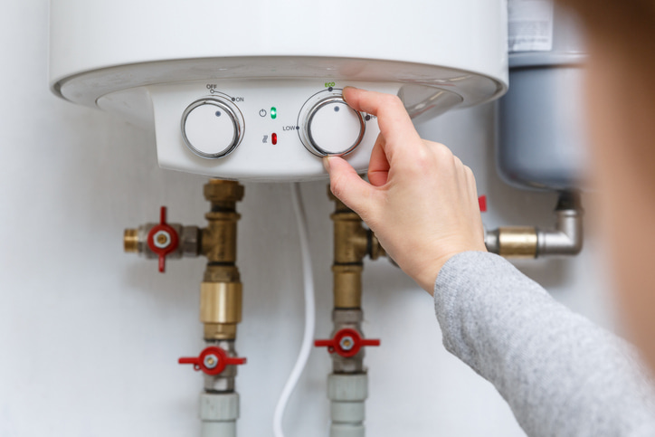 Professional technician installing a water heater in Olympia, WA